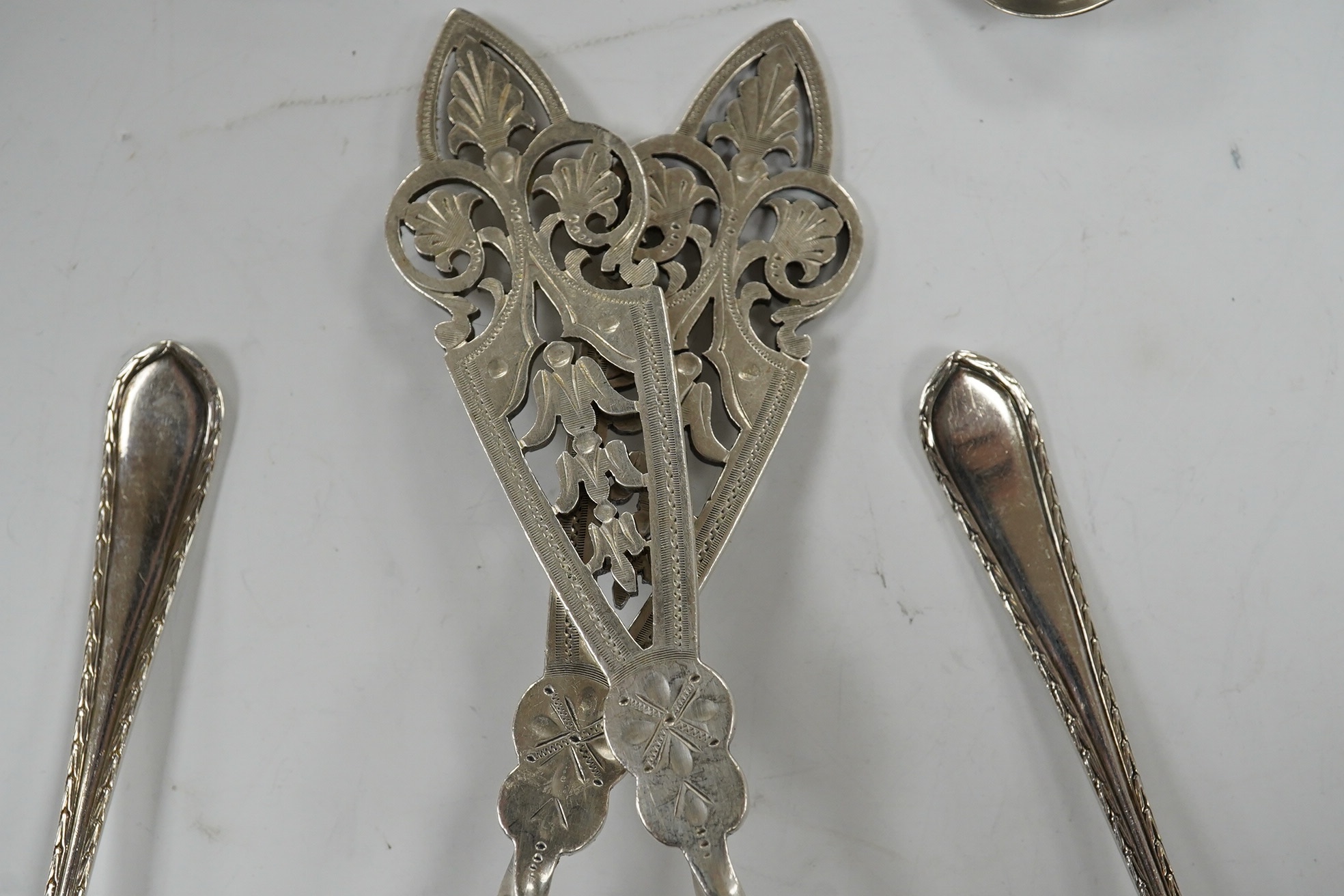 A pair of Edwardian silver serving spoons, Sheffield, 1901, 21.6cm and a quantity of assorted minor silver flatware. Condition - poor to fair